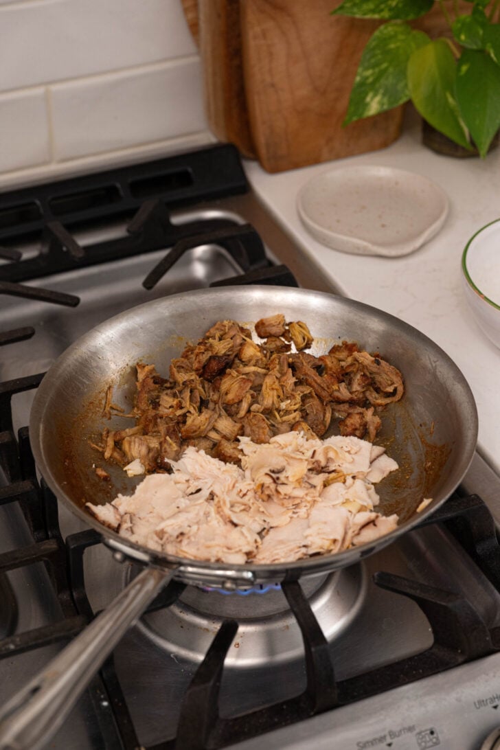 Pernil and deli meat heating in a pan.