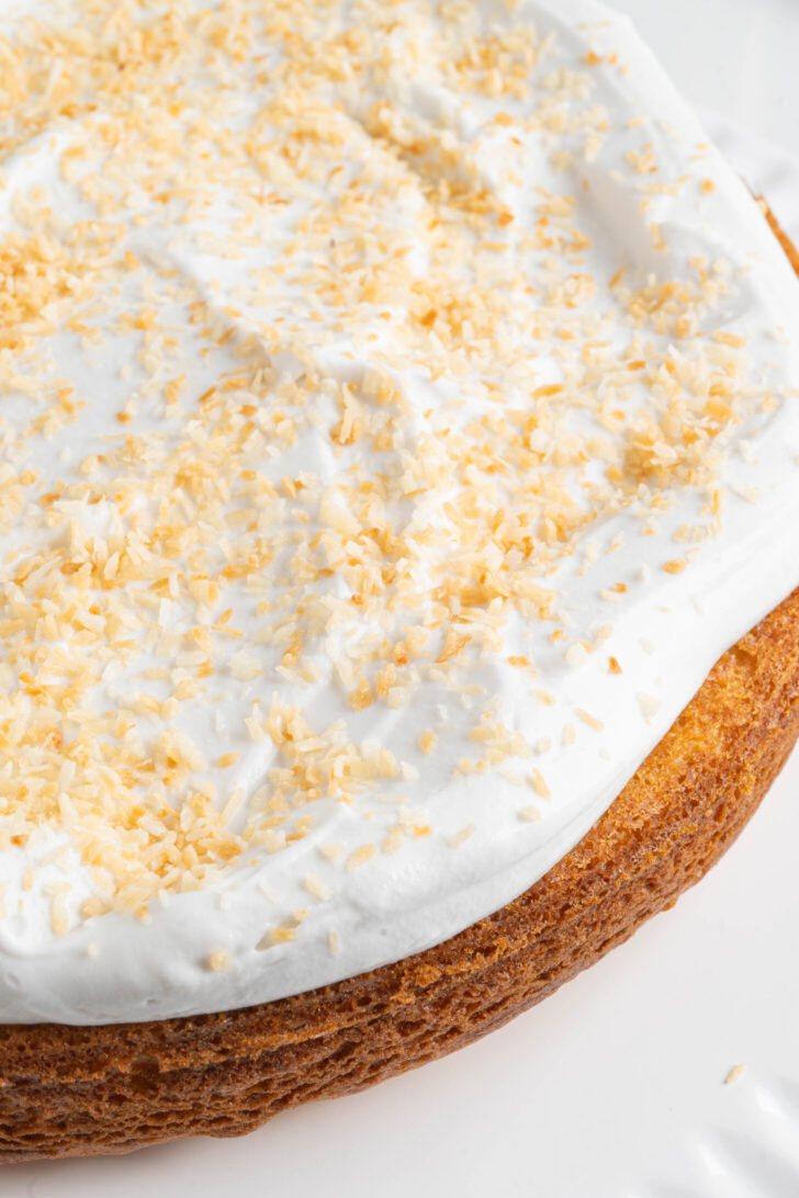 A pina colada cake on a cake stand.