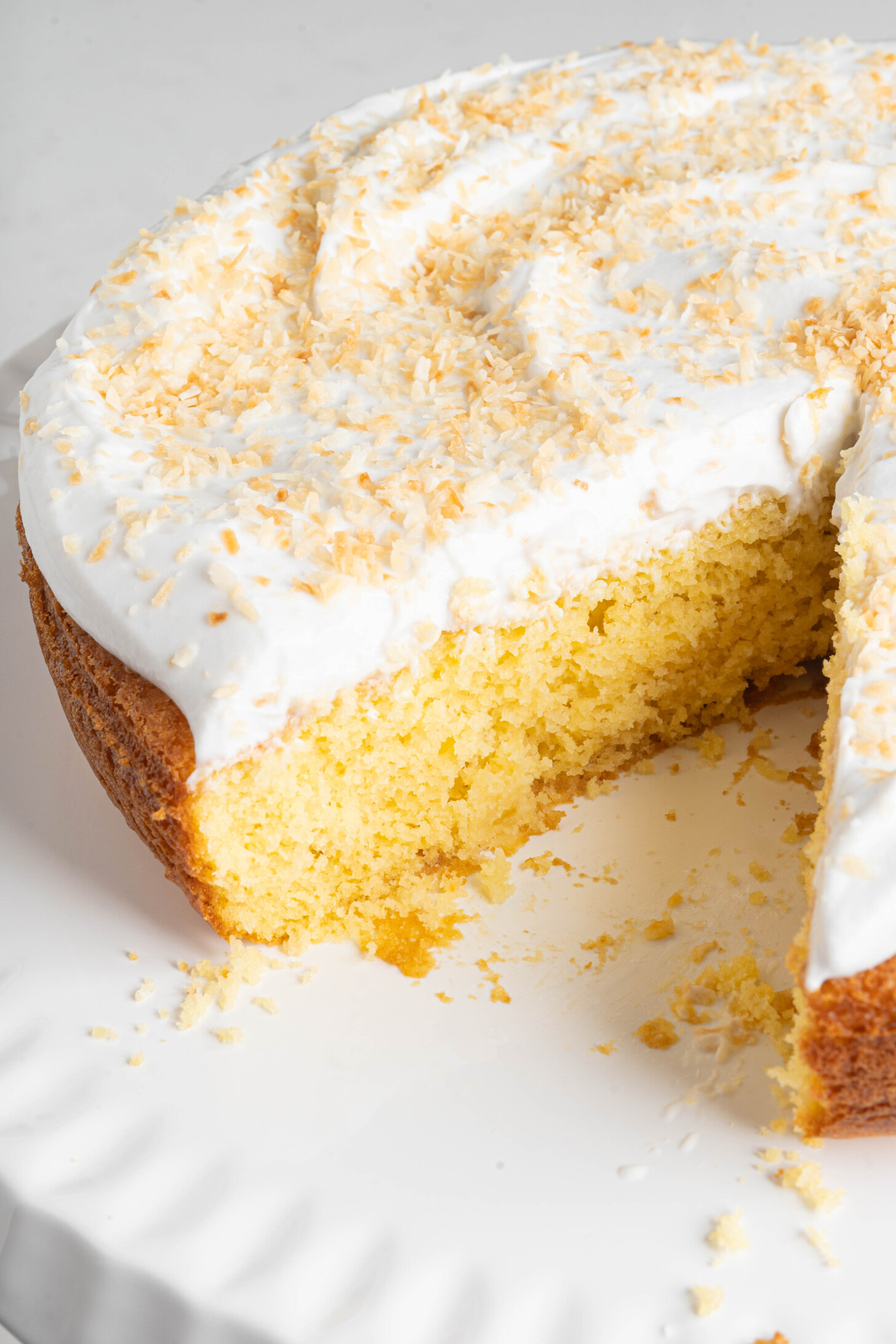 A pina colada cake on a cake stand.