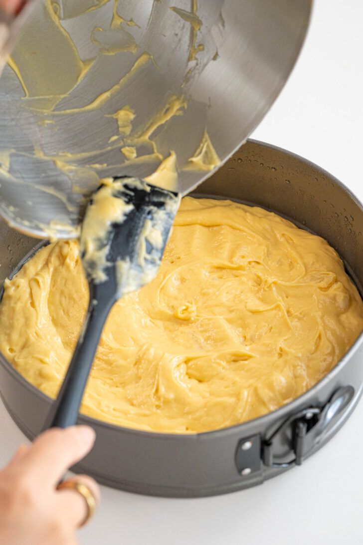 Cake batter pouring into a pan.