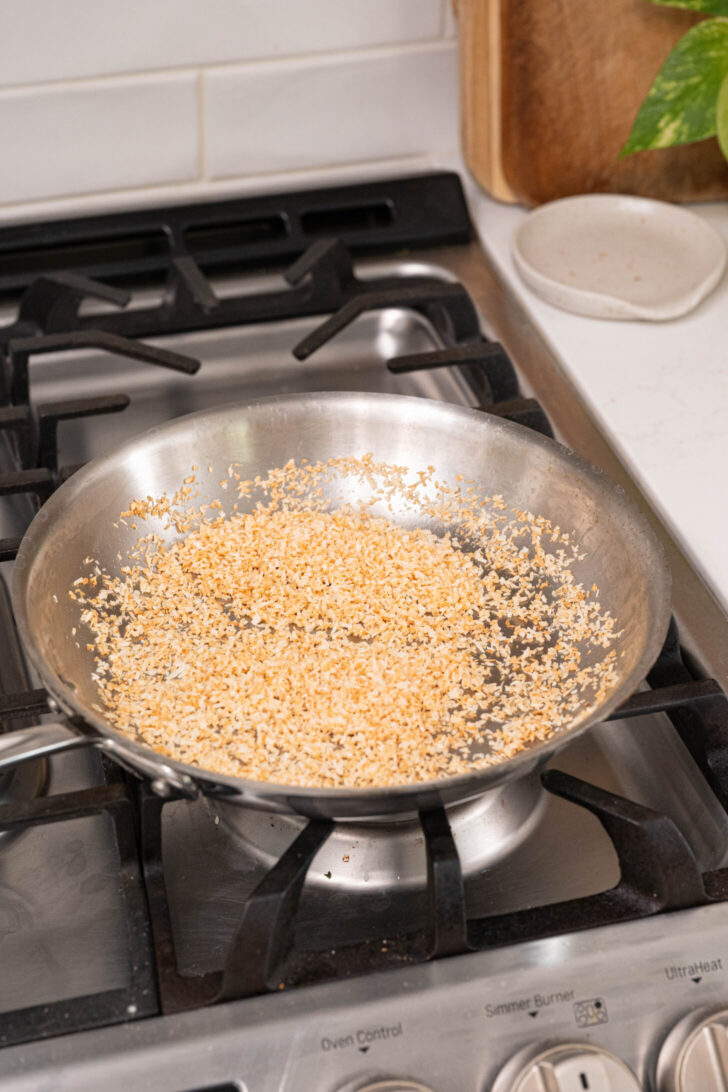Toasted coconut in a pan.