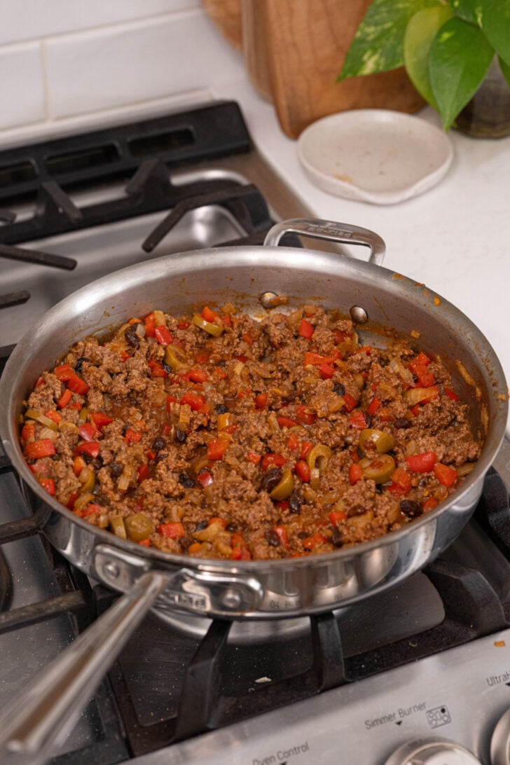 Picadillo cooking in a pan.