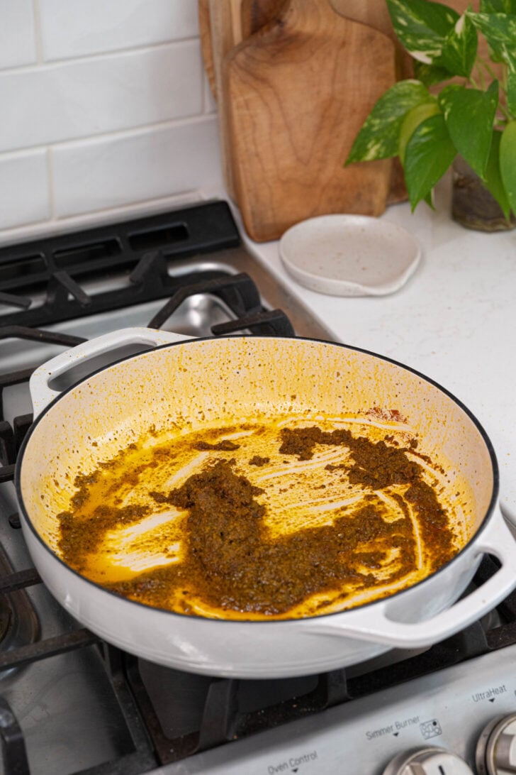 Sofrito and spices in a pot.